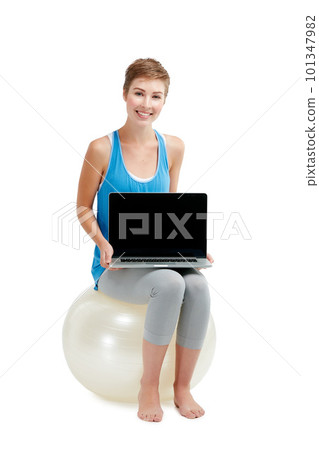 Laptop mockup, fitness and woman isolated on a white background sitting on balance ball and pc screen. Happy model or person with computer mock up space for advertising or product placement in studio Laptop mockup, fitness and woman isolated on a white background sitting on balance ball and pc screen. Happy model or person with computer mock up space for advertising or product placement in studio 101347982