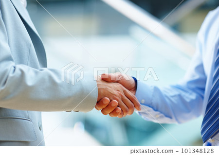 Youve got yourself a deal. two people shaking hands in a corporate environment. Youve got yourself a deal. two people shaking hands in a corporate environment. 101348128