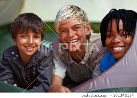 Good times with my mates. Crop shot of a group of friends in a tent while camping. Good times with my mates. Crop shot of a group of friends in a tent while camping. 101348154