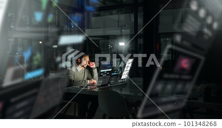 Businessman, futuristic digital interface and analytics at night for planning, strategy or stock market research at office. Male analyst working late for trading, fintech or big data management Businessman, futuristic digital interface and analytics at night for planning, strategy or stock market research at office. Male analyst working late for trading, fintech or big data management 101348268