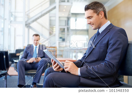 Relax, tablet and networking with businessman in lounge of corporate company for search, internet and contact. Communication, planning and idea with men in lobby for technology, goal and email Relax, tablet and networking with businessman in lounge of corporate company for search, internet and contact. Communication, planning and idea with men in lobby for technology, goal and email 101348350