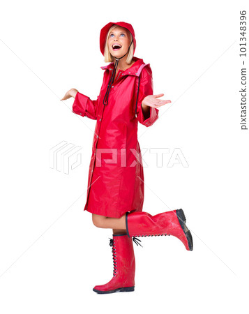 Winter, red raincoat and woman on a white background with smile, content and happy mindset. Creative aesthetic, weather and isolated full body of girl with boots for style, trendy clothes and fashion 101348396