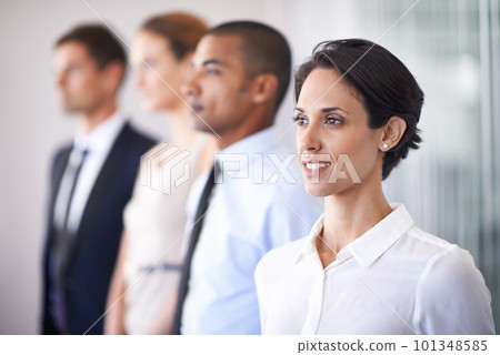 Standing with the best of her colleagues. a group of professional business people in the office. Standing with the best of her colleagues. a group of professional business people in the office. 101348585