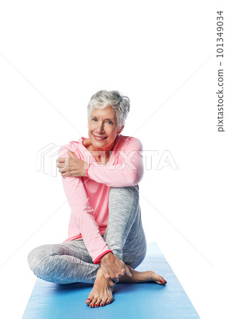 Senior woman, yoga and portrait in studio isolated on a white background. Zen chakra, pilates fitness and retired female from Canada sitting on training or stretching break for health or wellness. Senior woman, yoga and portrait in studio isolated on a white background. Zen chakra, pilates fitness and retired female from Canada sitting on training or stretching break for health or wellness. 101349034