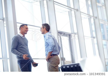 Airport, lounge and partner communication of business people talking, networking and chat about airplane journey. Conversation, discussion or corporate employee, worker or agent speaking about travel Airport, lounge and partner communication of business people talking, networking and chat about airplane journey. Conversation, discussion or corporate employee, worker or agent speaking about travel 101349391