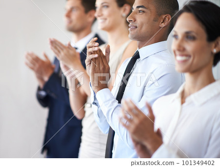 That deserves a round of applause. a group of coworkers clapping. That deserves a round of applause. a group of coworkers clapping. 101349402