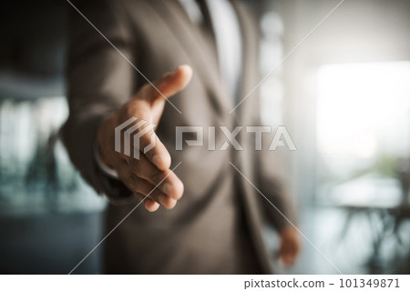 Closeup of professional executive businessman reaching for handshake to thank you for formal interview meeting. Corporate company manager hiring new employee in leadership development 101349871