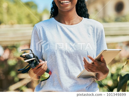 Woman, hands or gardening equipment with tablet for plant growth management, agriculture or sustainability work. Smile, happy or farmer and technology, tools or environment rake for field development 101349899