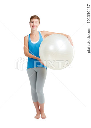 Portrait, workout and woman with fitness ball for wellness and health isolated against a studio white background. Exercise, training and fit happy female ready for healthy body and lifestyle Portrait, workout and woman with fitness ball for wellness and health isolated against a studio white background. Exercise, training and fit happy female ready for healthy body and lifestyle 101350487