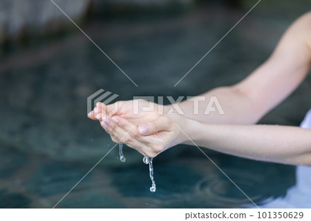 Hand scooping hot spring water Hand scooping hot spring water 101350629