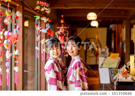 Hanging chicks and a young woman Hanging chicks and a young woman 101350686