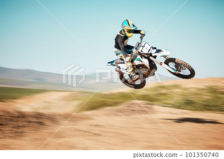 Motorcross, air jump and offroad sports with motion blur, speed challenge or desert. Driver, cycling and stunt on dirt track, competition and motorbike performance on adventure course for fast action 101350740