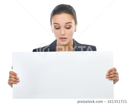 Looking for new business ideas. Studio shot of an attractive young businesswoman holding a blank placard for copyspace. Looking for new business ideas. Studio shot of an attractive young businesswoman holding a blank placard for copyspace. 101351721