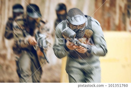 Adventure, paintball and action with people in field for sports, target and shooting games. War, soldier and community with man gamer playing in camouflage for military, army and competition training 101351760