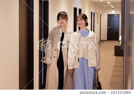 Young woman moving to her room after checking in at the hotel 101351860