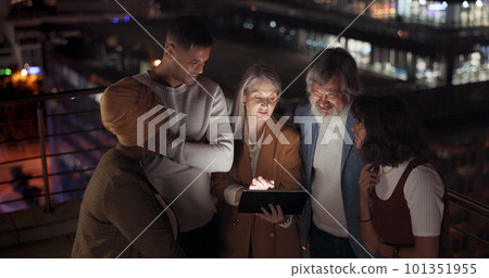 Tablet, collaboration and night with a business team working together in the city on their office balcony. Finance, teamwork and meeting with a man and woman employee group talking strategy outside Tablet, collaboration and night with a business team working together in the city on their office balcony. Finance, teamwork and meeting with a man and woman employee group talking strategy outside 101351955