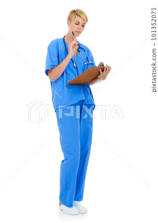Taking a look at a patients chart. A young female doctor holding a clipboard against a white background. 101352071