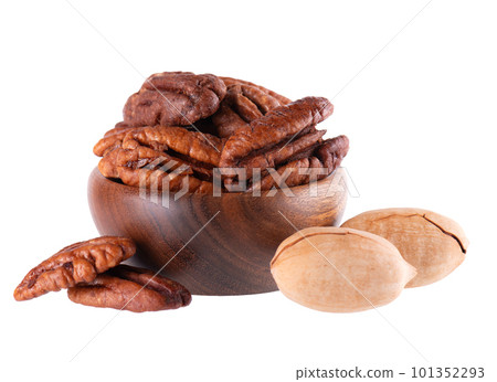 Pecan nuts in wooden bowl, isolated on white background. Shelled and unshelled pecan. Clipping path. Pecan nuts in wooden bowl, isolated on white background. Shelled and unshelled pecan. Clipping path. 101352293