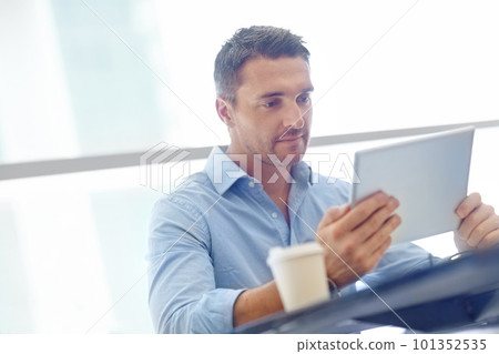 Corporate, thinking or businessman with tablet in airport lobby for communication, networking or news blog read. Focus, travel or manager with tech for social media app, social network or web search Corporate, thinking or businessman with tablet in airport lobby for communication, networking or news blog read. Focus, travel or manager with tech for social media app, social network or web search 101352535