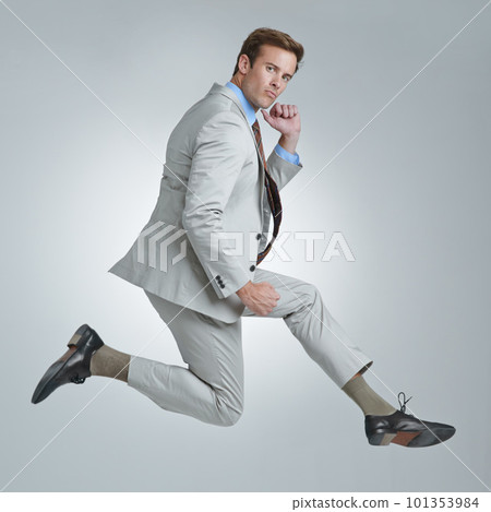 Business ego. A young businessman wildly celebrating his success. 101353984