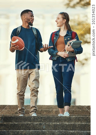 Students, couple and conversation in walk on stairs at college, university or school books. Friends, diversity and campus for learning, education or study in discussion, together and walking to class Students, couple and conversation in walk on stairs at college, university or school books. Friends, diversity and campus for learning, education or study in discussion, together and walking to class 101354023