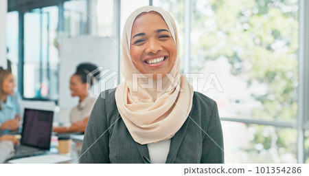 Face, muslim and mindset with a business woman in her office at work wearing a hijab for religion or faith. Portrait, vision and smile with an islamic female employee standing in her workplace 101354286
