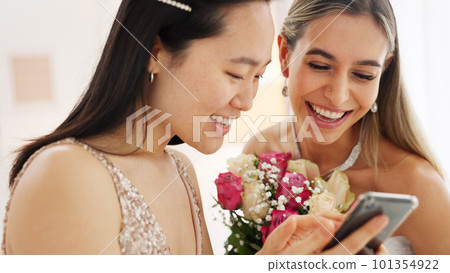 Wedding, phone and women on social media app reading notification, chat app and happy with digital gallery. Asian girl or bride friends on internet with smartphone to scroll and review online post 101354922