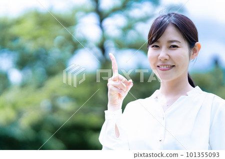 A smiling woman enjoying the fresh green A smiling woman enjoying the fresh green 101355093