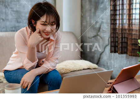Generation Z woman using a laptop while taking a break Generation Z woman using a laptop while taking a break 101355993