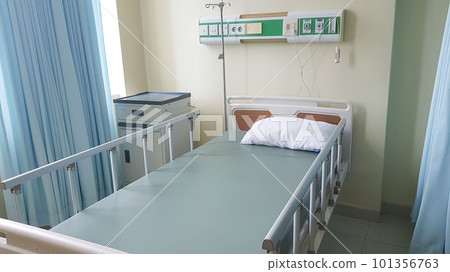 Surakarta, Indonesia, Jan 2023, Interior of recovery room in intensive care unit at Muwardi Hospital. Empty bed with medical equipment in background Surakarta, Indonesia, Jan 2023, Interior of recovery room in intensive care unit at Muwardi Hospital. Empty bed with medical equipment in background 101356763