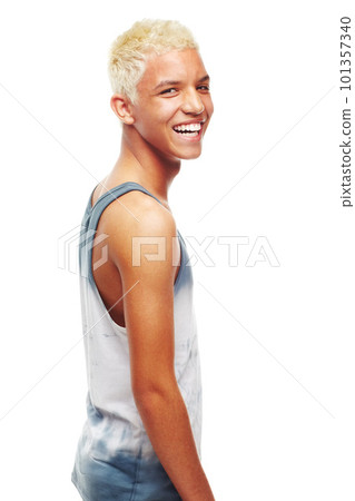 Youthful confidence. Portrait of a happy young teenage boy looking over his shoulder isolated on white. 101357340