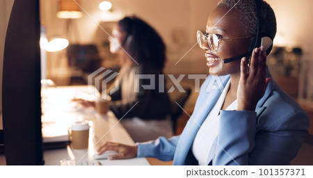 Call center, customer service and night shift black woman telemarketing consultant wearing headset at computer. Sales female in contact us and crm support talking during call working late with smile Call center, customer service and night shift black woman telemarketing consultant wearing headset at computer. Sales female in contact us and crm support talking during call working late with smile 101357371