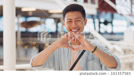 Shopping, hands in heart and face of Asian man with smile for shopping, retail and consumerism. Lifestyle, commerce and male enjoying weekend at shopping mall in Tokyo for sale, discount and bargain 101357565