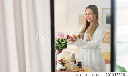 Smelling flowers, beautiful woman and beauty routine of a happy bride wearing a bathrobe while getting ready for her wedding day. Young female enjoying the aroma of fresh roses in her bedroom 101357828