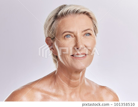 Skincare, beauty and wellness in retirement, a senior woman isolated against a pink background in a studio. Happy elderly female with a good skin care and healthy routine is self care for your face. 101358510