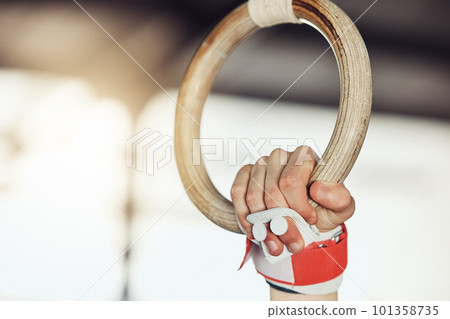 Gym, ring and sport gymnastic athlete training for muscle, balance and flexibility strength, in exercise fitness center. Motivation and health wellness workout with hand holding support equipment 101358735