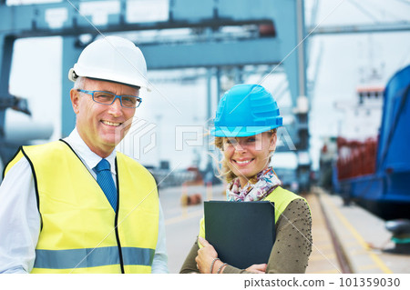 Portrait shipping, logistics and cargo delivery workers smile at a dock in the supply chain industry. Contain export management or employee collaborate to get the package or stock transport on boat Portrait shipping, logistics and cargo delivery workers smile at a dock in the supply chain industry. Contain export management or employee collaborate to get the package or stock transport on boat 101359030