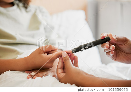 Diabetes, diabetic and mother testing blood sugar levels of a child with a chronic disease at home. Closeup of mom measuring, checking and monitoring glucose in her kid in bed or in the bedroom Diabetes, diabetic and mother testing blood sugar levels of a child with a chronic disease at home. Closeup of mom measuring, checking and monitoring glucose in her kid in bed or in the bedroom 101359053