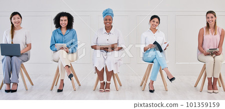 Female corporate marketing or advertising planning team working in a creative agency for online website design company. Portrait of empowering women in diverse workplace with good ideas and strategy 101359159