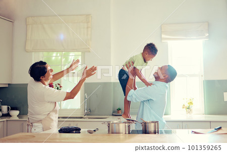 Family, father and son in the kitchen with happy, playful and joy time at home smiling in happiness. Parents in care, love and fun with child together in a house playing with smile and funny moments. Family, father and son in the kitchen with happy, playful and joy time at home smiling in happiness. Parents in care, love and fun with child together in a house playing with smile and funny moments. 101359265