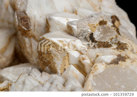 Macro mineral stone Snow quartz with calcite on a black background 101359729