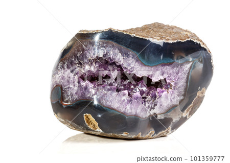 Macro Mineral Stone Amethysts in the rock on a white background 101359777