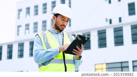 Male engineer checking data on digital tablet and inspecting construction site. Technician in a hardhat doing management and project planning outdoors. Skilled worker looking or overseeing operations 101359982