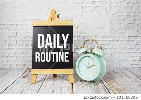 Daily Routine text message and alarm clock on wooden background 101360289