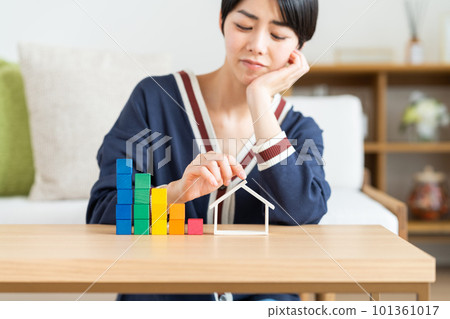 Young woman worried about mortgage 101361017