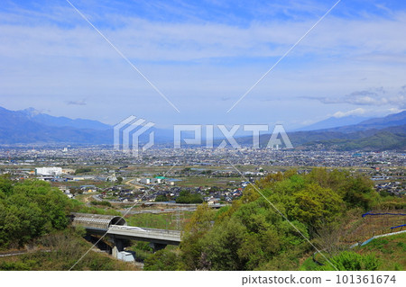 Linear and Yamanashi mountains going through the fresh green Kofu Basin 101361674