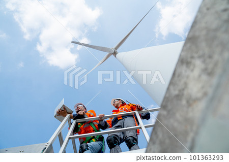 Lower view of engineer or technician worker use laptop and work with coworker also stand on base Lower view of engineer or technician worker use laptop and work with coworker also stand on base 101363293