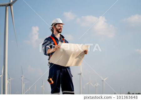 Smart engineer or technician man stand with holding drawiing paper and look forward Smart engineer or technician man stand with holding drawiing paper and look forward 101363648