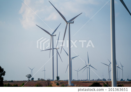 Windmill or wind turbine cluster in the field with blue sky for concept of geen energy to save world Windmill or wind turbine cluster in the field with blue sky for concept of geen energy to save world 101363651