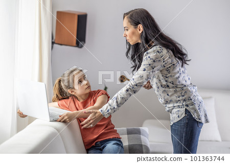 Conflict between generations as mother tries to take pc away from daughter who is always online 101363744